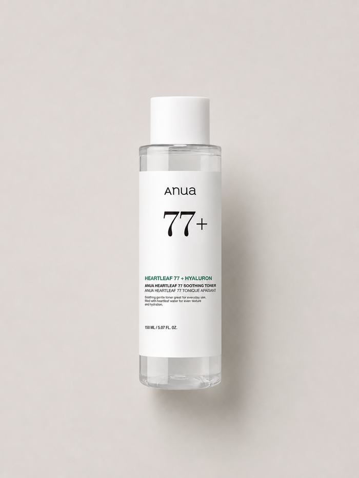 Korean Skincare - Anua Heartleaf 77+ Hyaluron Soothing Toner in a transparent bottle with a white cap and white label, centered against a light greige background. 150 ml.