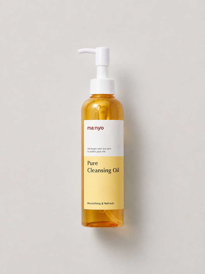 A bottle of korean skincare oil - manyo Pure Cleansing Oil with a white pump dispenser, set against a solid light gray background. 200 ml.