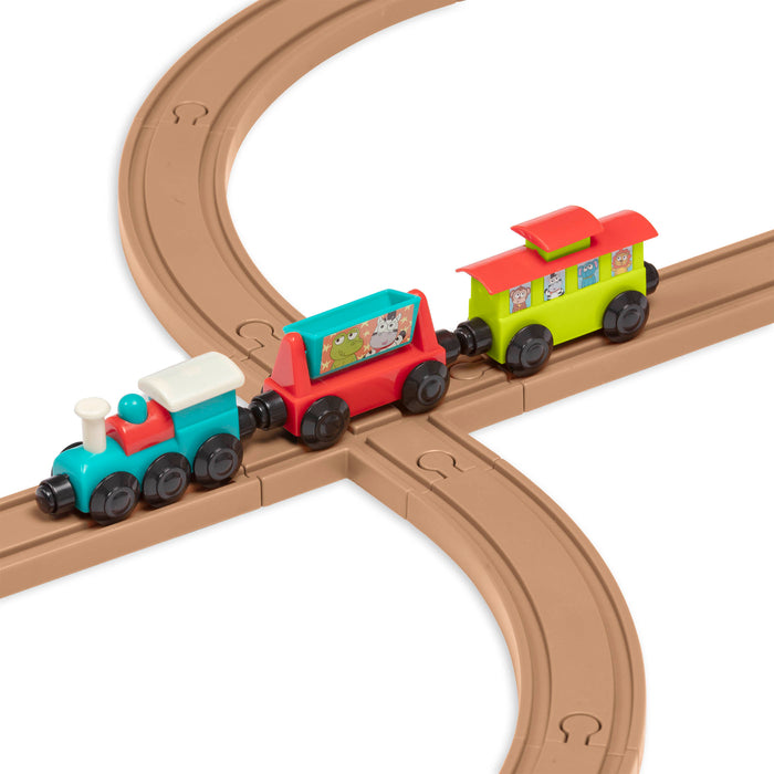 Toy train set with tracks and colorful trains and accessories