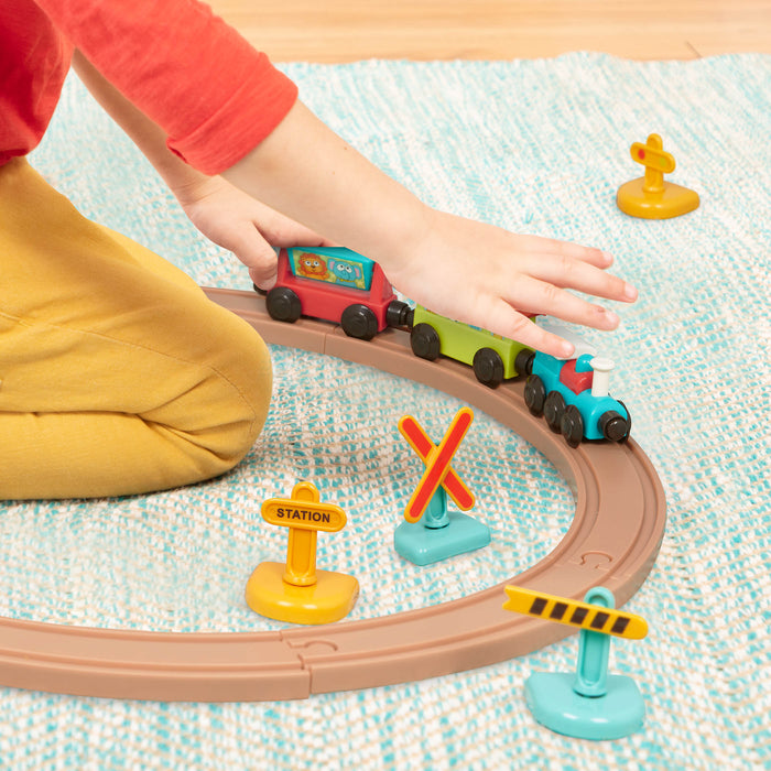 Toy train set with tracks and colorful trains and accessories