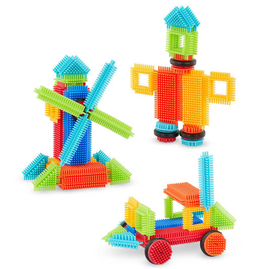 Creations made with Bristle Blocks, including a car with functional wheels.
