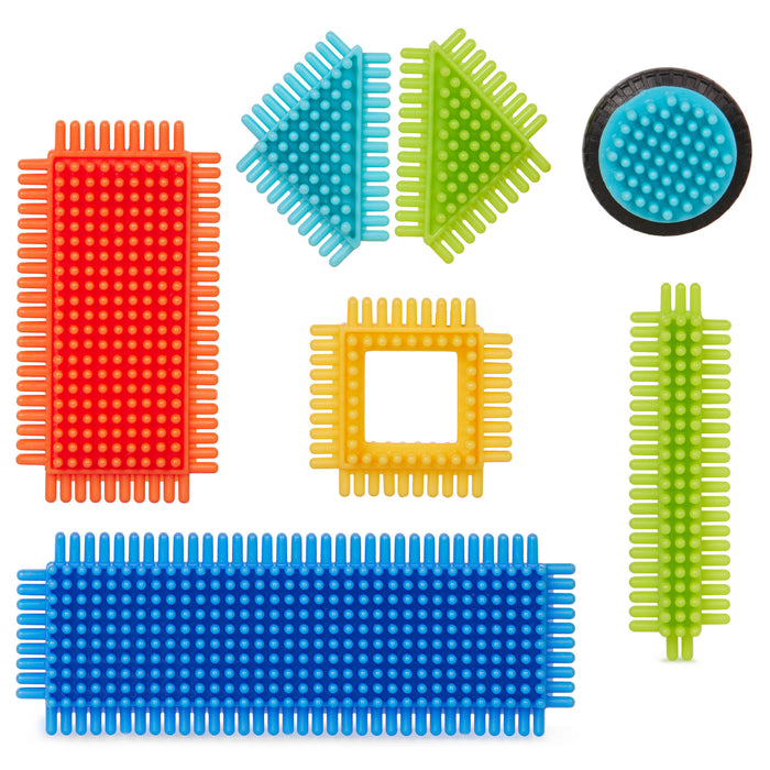 Creations made with Bristle Blocks, including a car with functional wheels.