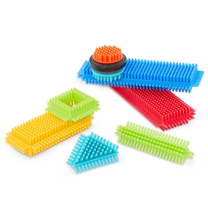 Creations made with Bristle Blocks, including a car with functional wheels.