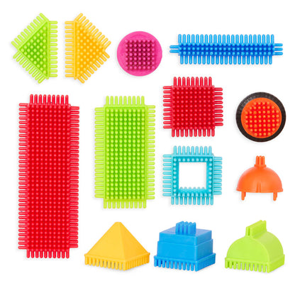 Bristle Blocks laid out in a rainbow pattern.