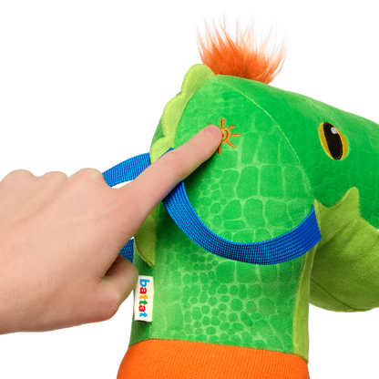 green dino hobby horse with wooden riding pole