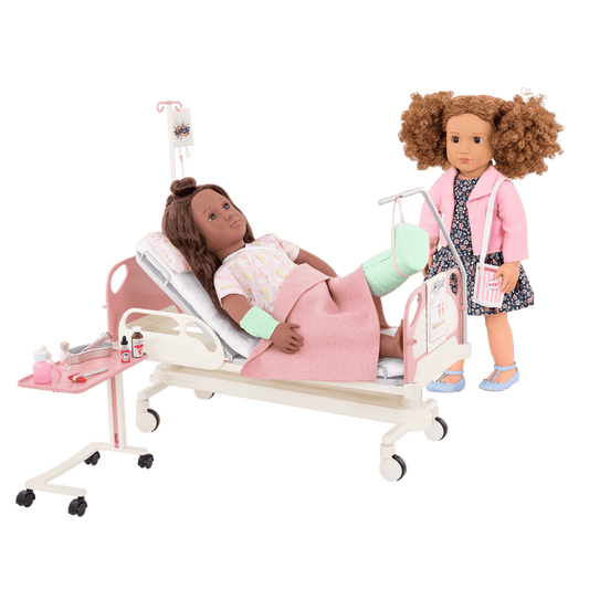 Two 18-inch dolls with hospital gurney playset