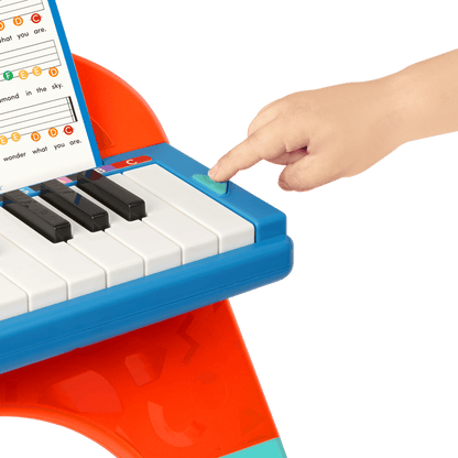 Toy piano and songsheet