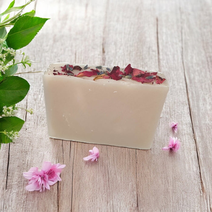 Think Pink Organic Soap unwrapped with dried flowers on top